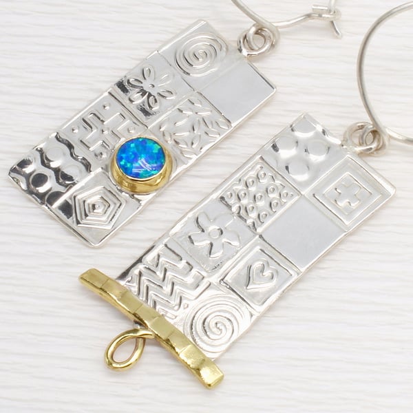 Asymmetrical handmade earrings, sterling silver with a blue Opal. Stone choice