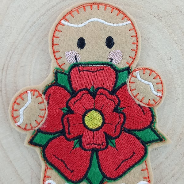 Gingerbread Man Holding a Lancashire Rose Felt Hanging Decoration