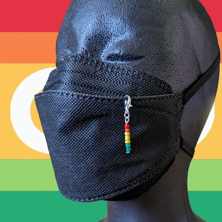 Autistic pride beaded charm