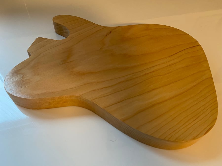 Guitar shaped wooden chopping board
