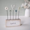 Heart and Button Flowers in a Painted Wood Block 'love'