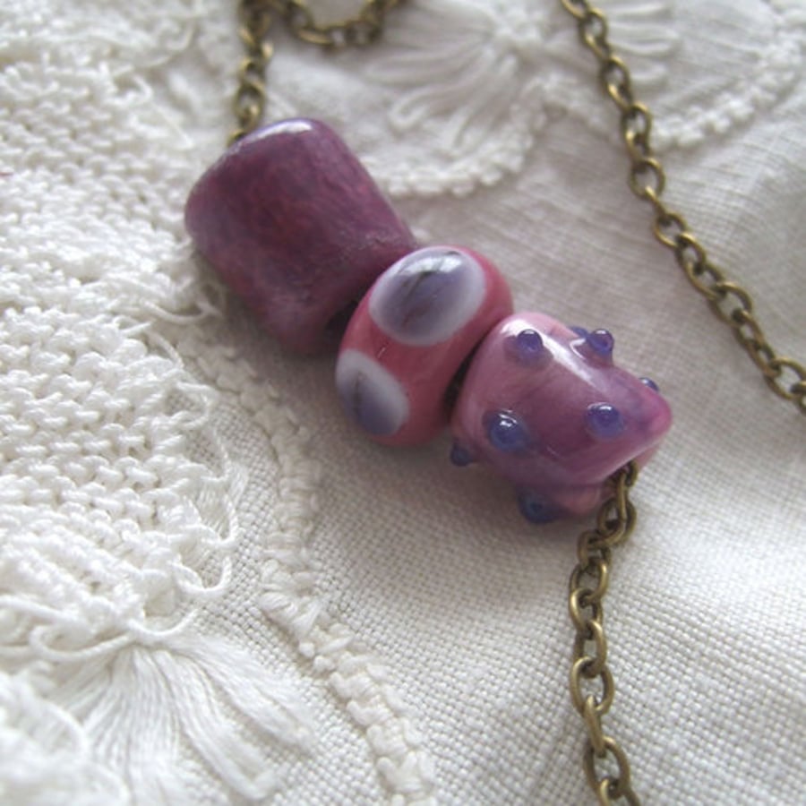 Necklace of Lampworked Pink and Purple Harvest Beads