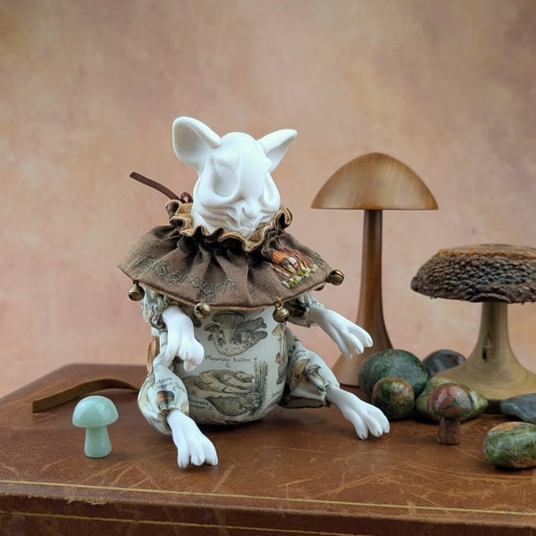 'Porcini’, a porcelain and textile mouse skull doll.
