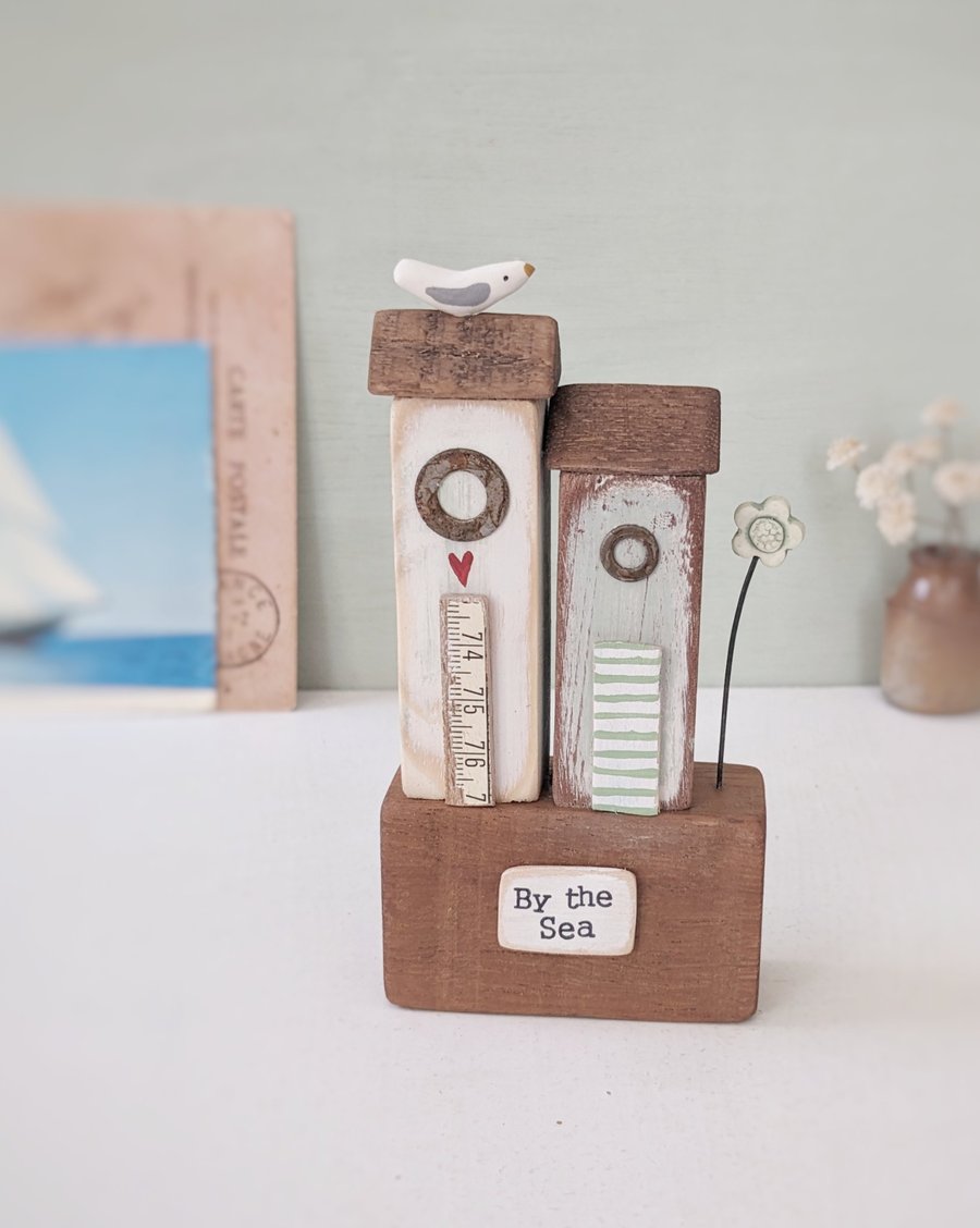 Tall Wooden Sea Huts with Clay Flower and Seagull 'By the Sea'