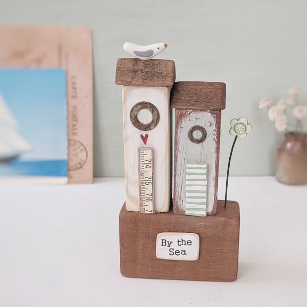 Tall Wooden Sea Huts with Clay Flower and Seagull 'By the Sea'