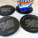 Slate coasters. Welsh sayings with dragon. 