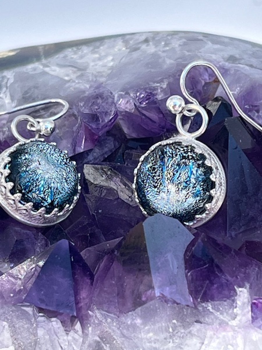 Silver earrings with a shimmering silver fused glass cabochon stone