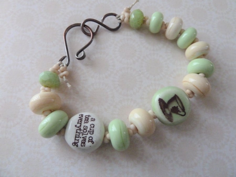 teacup inspirational quote bracelet, green and ivory