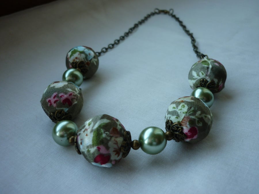 TAUPE SATIN KIMONO DESIGN BEAD NECKLACE.  230