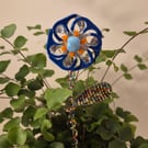 Silver, orange, blue flower plant companion perfect for pot plants
