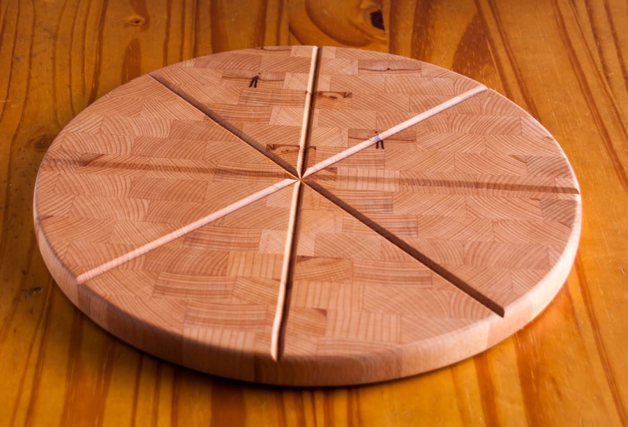 Reversible beech pizza cutting board