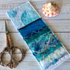 Embroidered seascape bookmark.