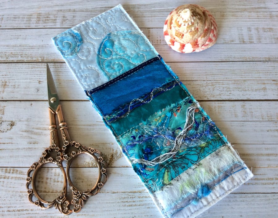 Embroidered seascape bookmark.