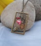 Bird with amber leaf and flower necklace - Image 1