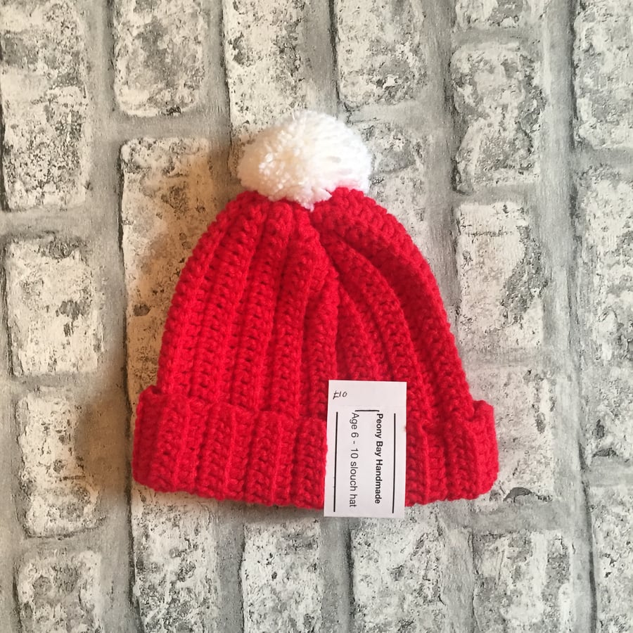 Red slouch pompom hat, age 6-10 years