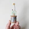 Wooden House on a Vintage Floral Bobbin with Clay Daisy