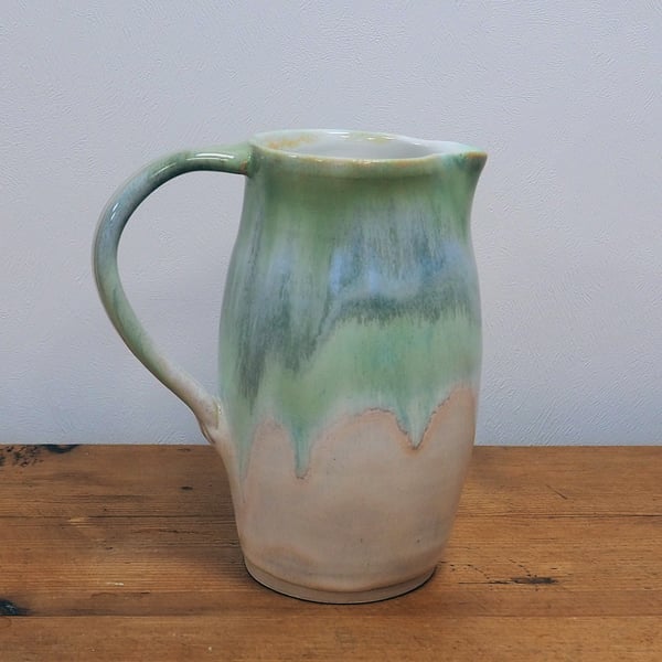 Stoneware pottery jug, multi-colour greens and cream glaze