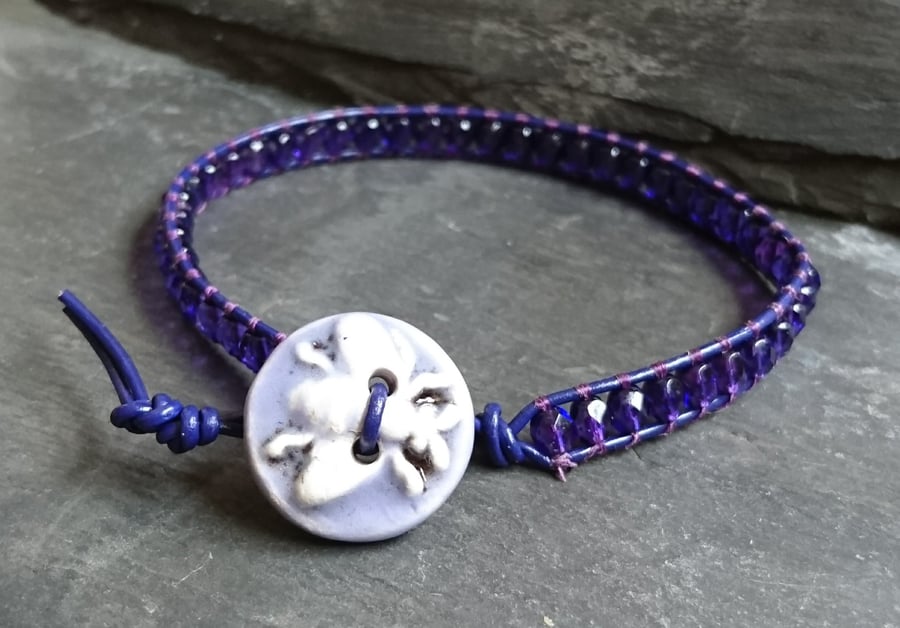 Purple leather and glass bead bracelet with ceramic bee button