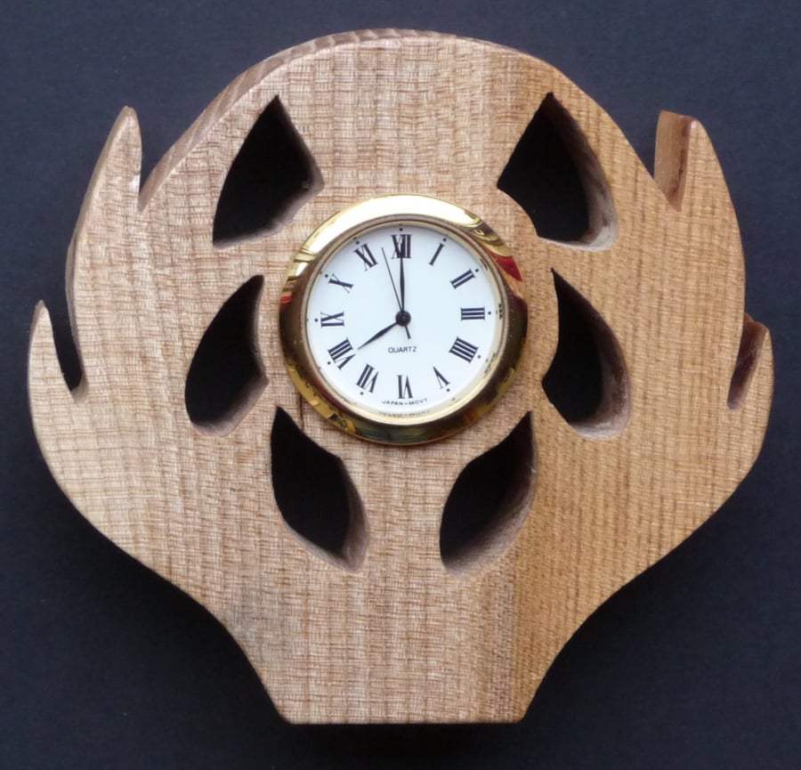 Shaped thistle clock