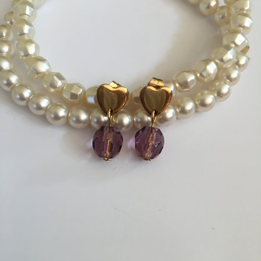 Elegant minimal lilac glass bead stud earrings.