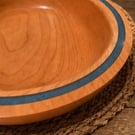 Handturned cherry bowl with blue resin inlay
