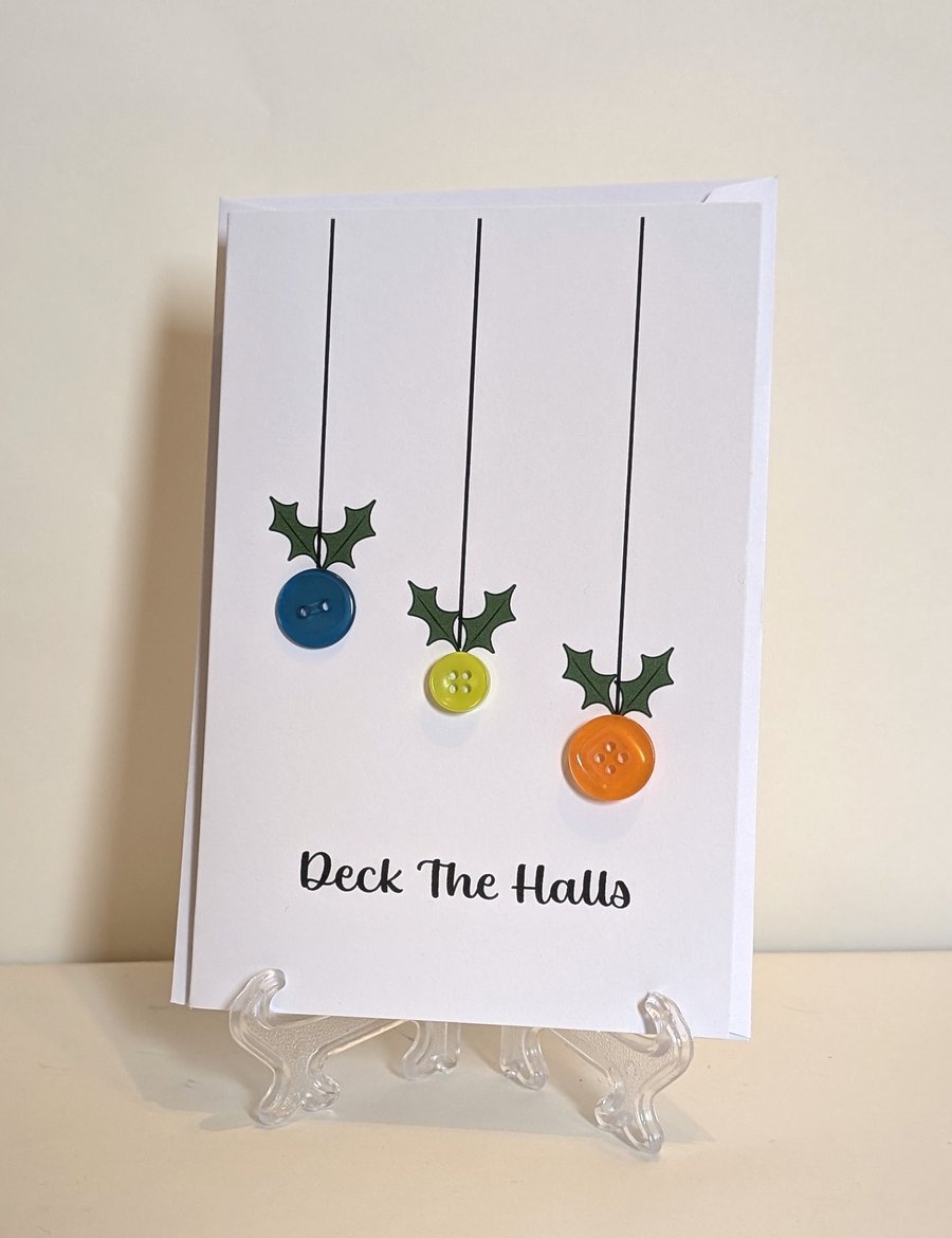 Christmas card with buttons saying Deck the Halls 