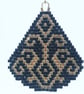 Teardrop Beaded Earrings in Black with Gold Geometric Pattern - Image 4