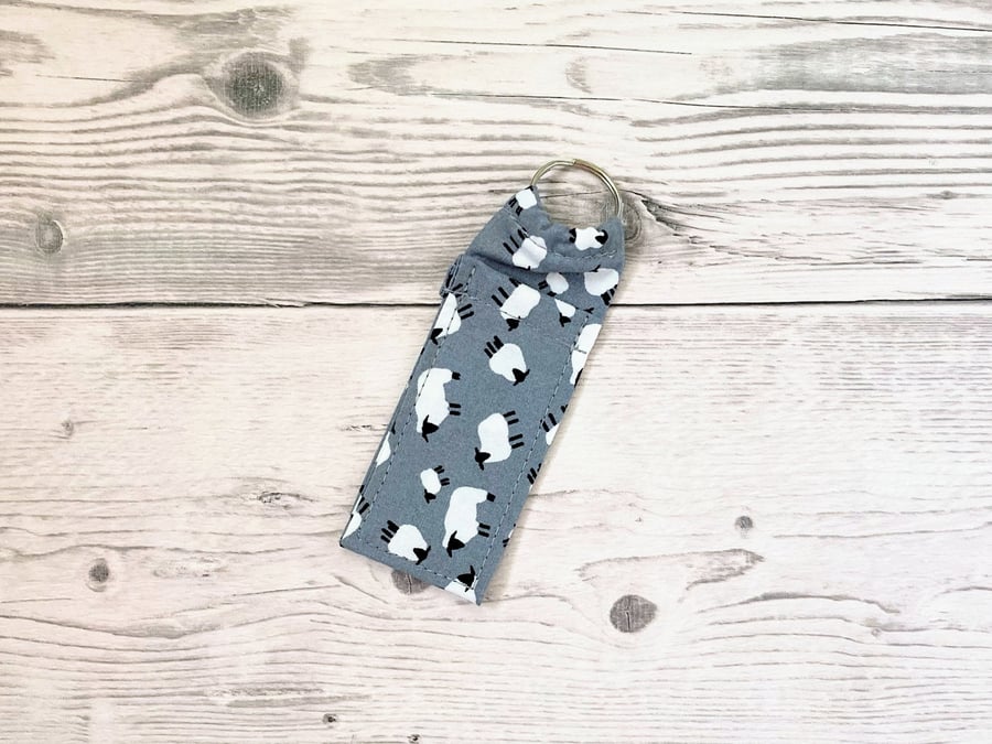 Sheep themed fun lip balm grey cotton fabric keyring. Farm animals theme. 