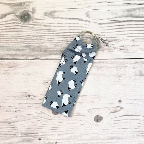 Sheep themed fun lip balm grey cotton fabric keyring. Farm animals theme. 