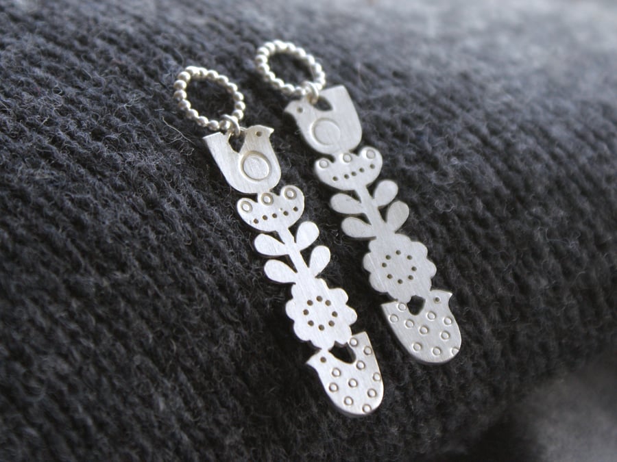 Silver totem flower and bird drop earrings