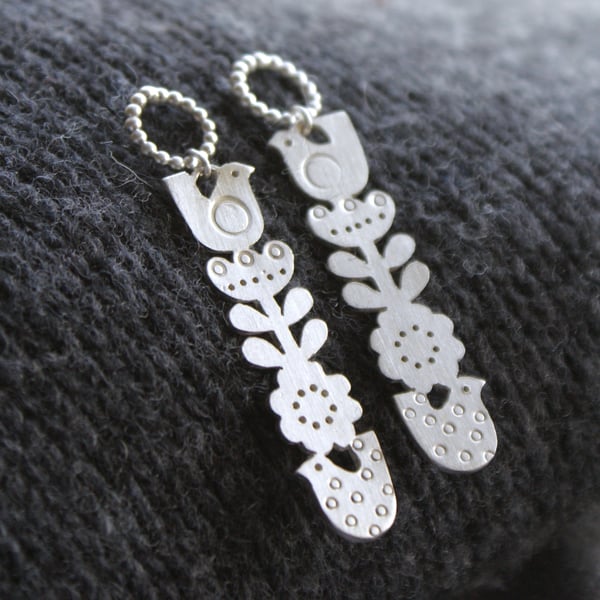Silver totem flower and bird drop earrings