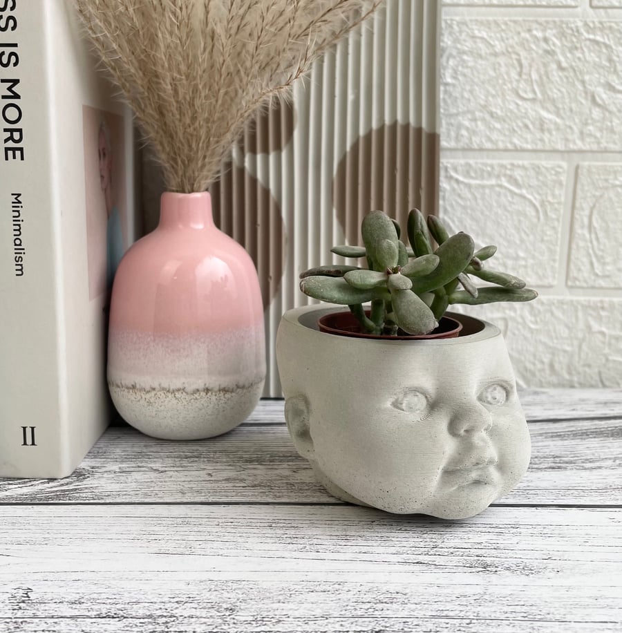 Concrete baby head planter