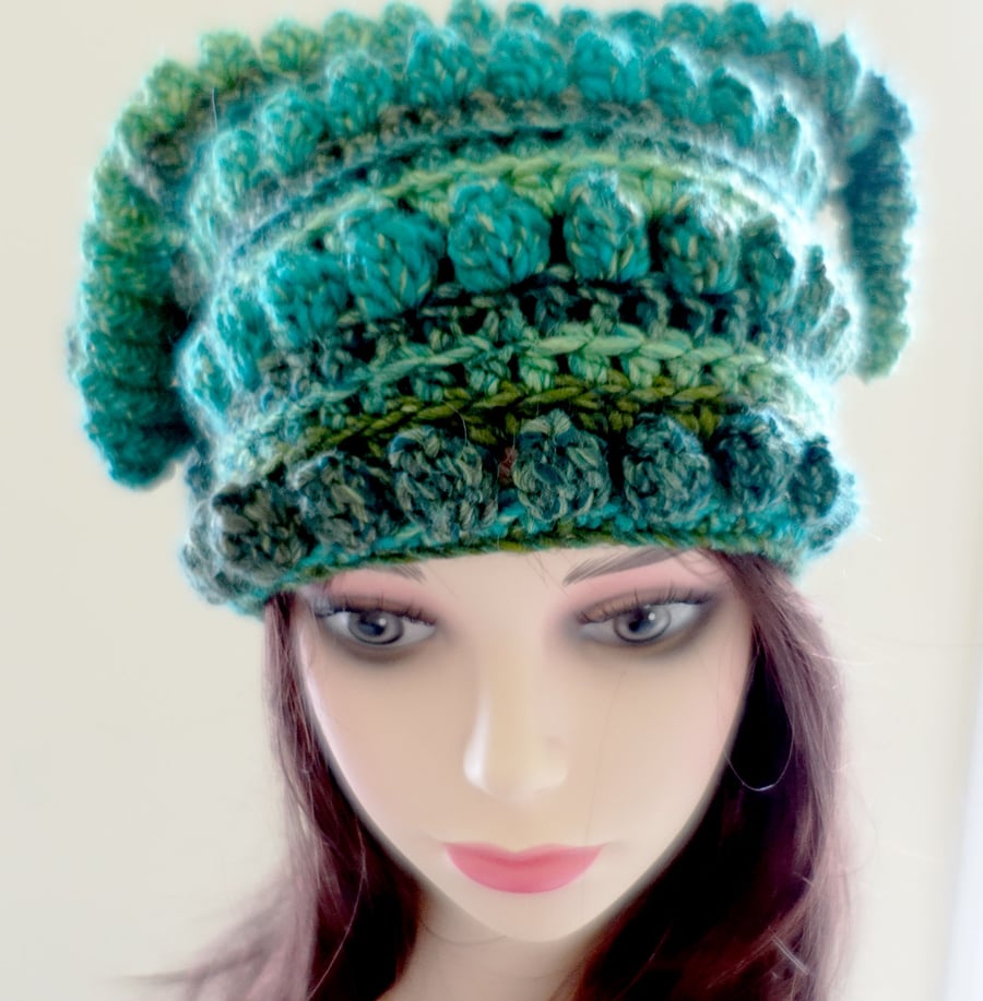 Crochet festival hat in deep emerald green.  Curly tassels.  Warm chunky acrylic