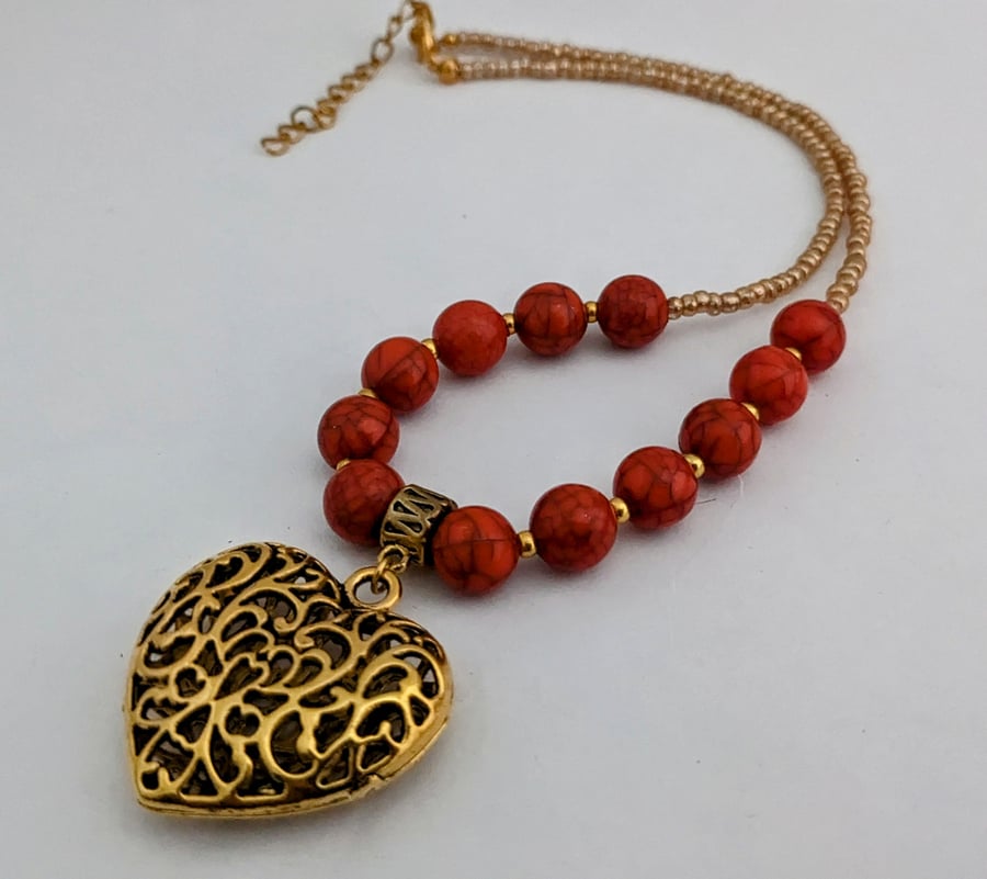 Coral bead necklace with gold filigree puffed heart pendant - 1002514H
