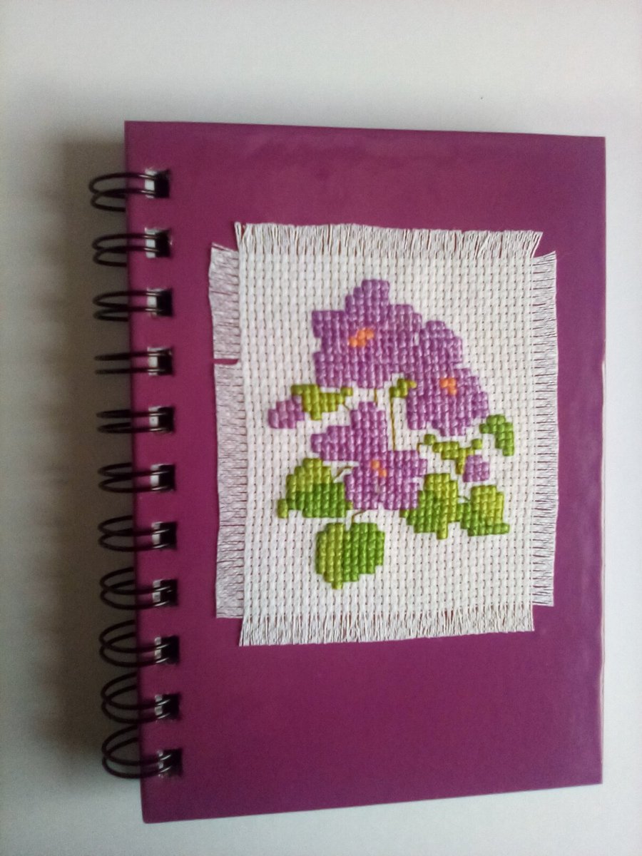 Violet hand stitched cross stitch floral notebook.