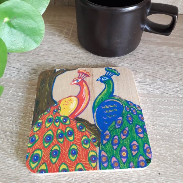 Square wooden Coaster hand drawn with two colourful peacock birds.  