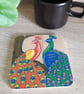 Square wooden Coaster hand drawn with two colourful peacock birds.  