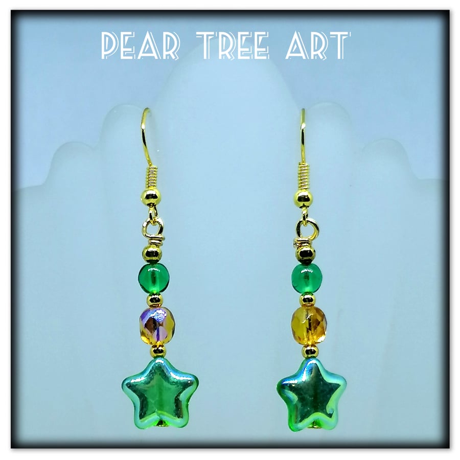 Green glass star bead earrings with amber crystal beads on gold plated hooks.