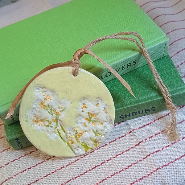 Meadowsweet imprinted and painted clay decoration