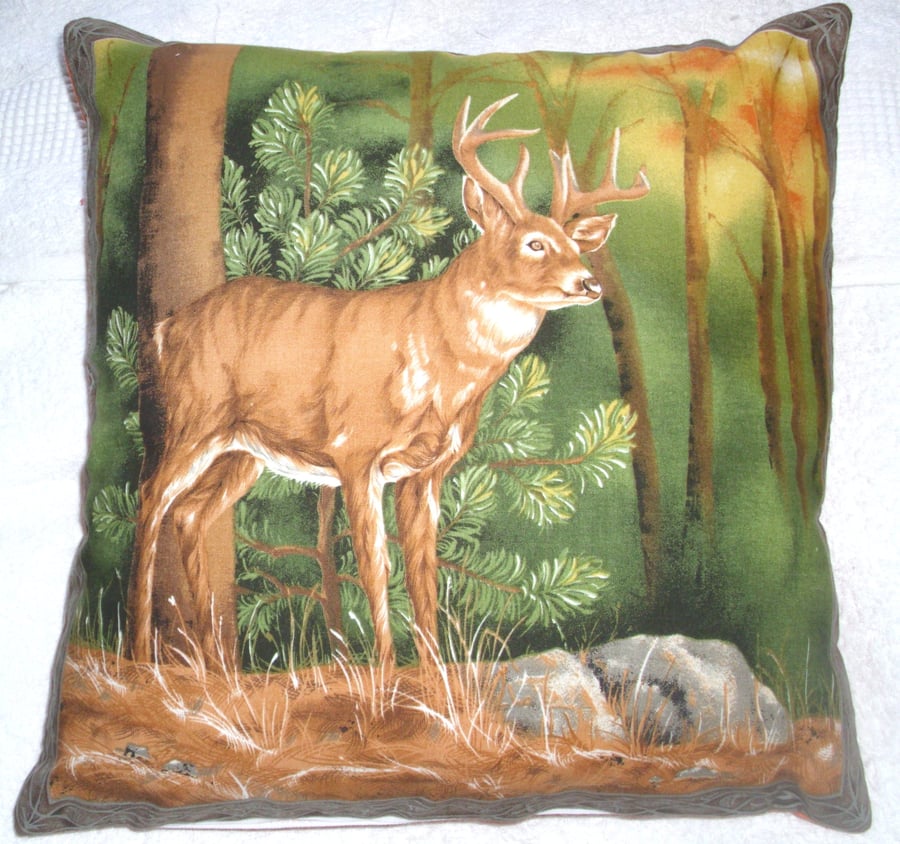 Stag standing in a clearing in an Autumnal forest cushion