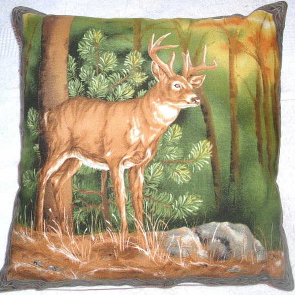 Stag standing in a clearing in an Autumnal forest cushion