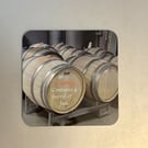 Contains a barrel...  9.5cm cork backed coaster 