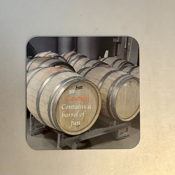 Contains a barrel...  9.5cm cork backed coaster 