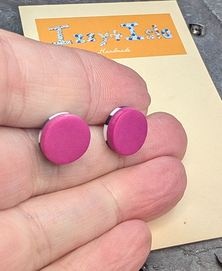 Hot pink stud earrings with a monochrome surprise