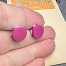 Hot pink stud earrings with a monochrome surprise