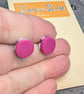 Hot pink stud earrings with a monochrome surprise