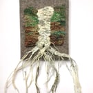 Mounted handwoven tapestry weaving,  textile art in browns, greens and cream