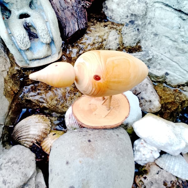 Wooden Bird could be a duck. 