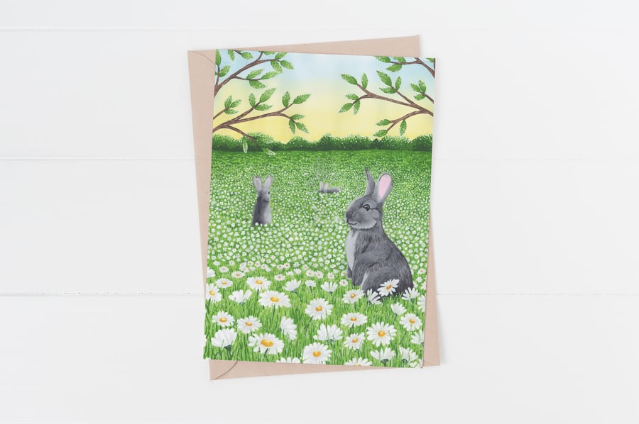 Rabbits in field of daisies all occasions greetings card