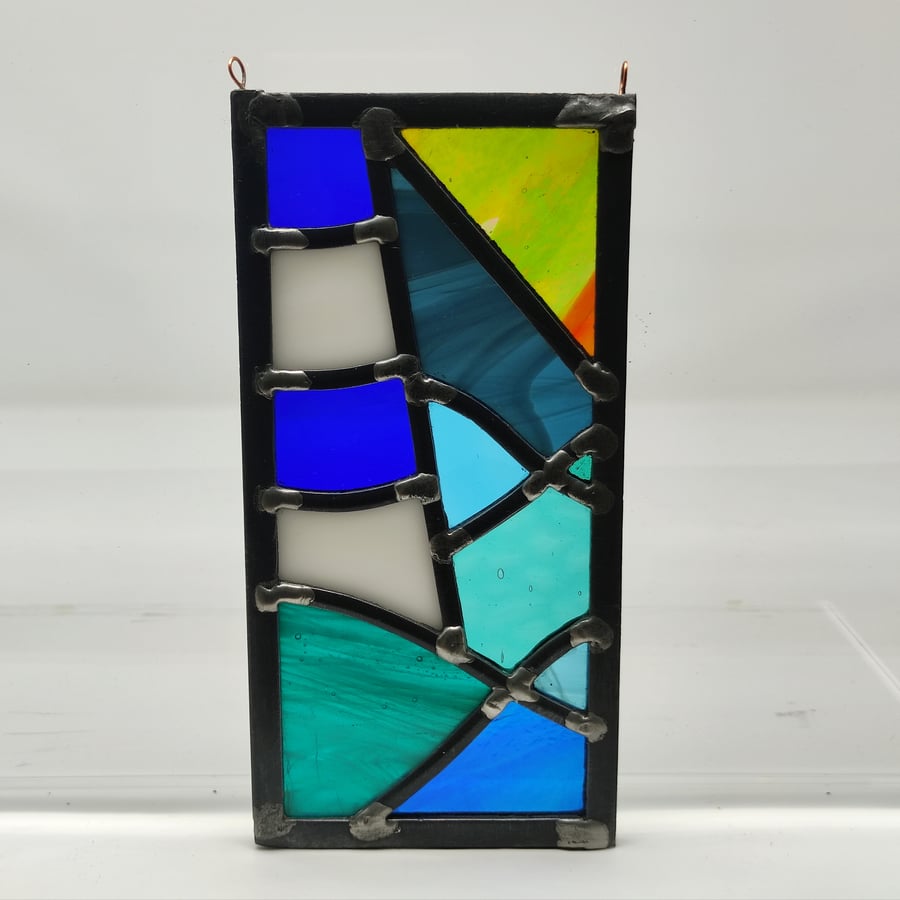 SOLD BLue and white lighthouse at night-time stained glass leaded hanging panel.